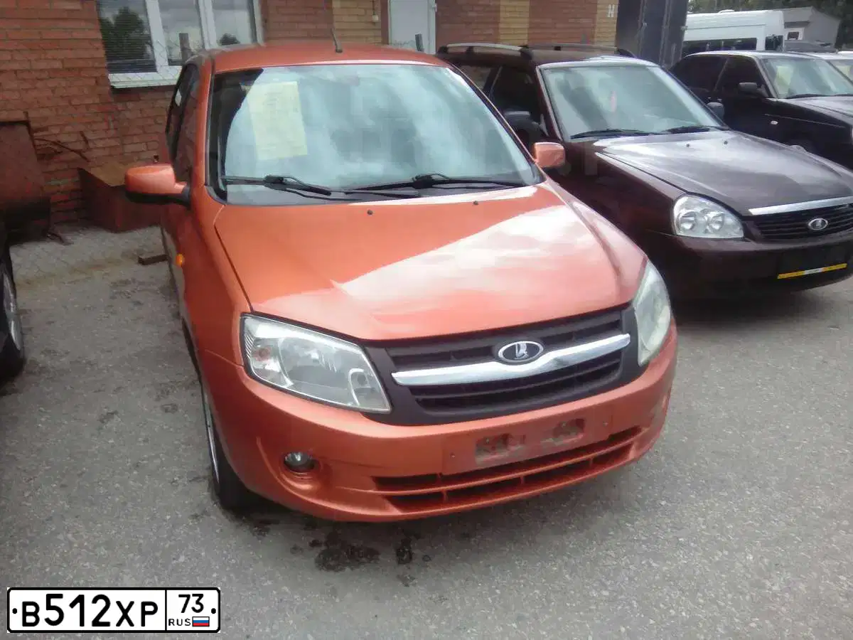 Фото автомобиля LADA 2190 GRANTA, 2013 — госномер В512ХР73. Цвет: Оранжевый