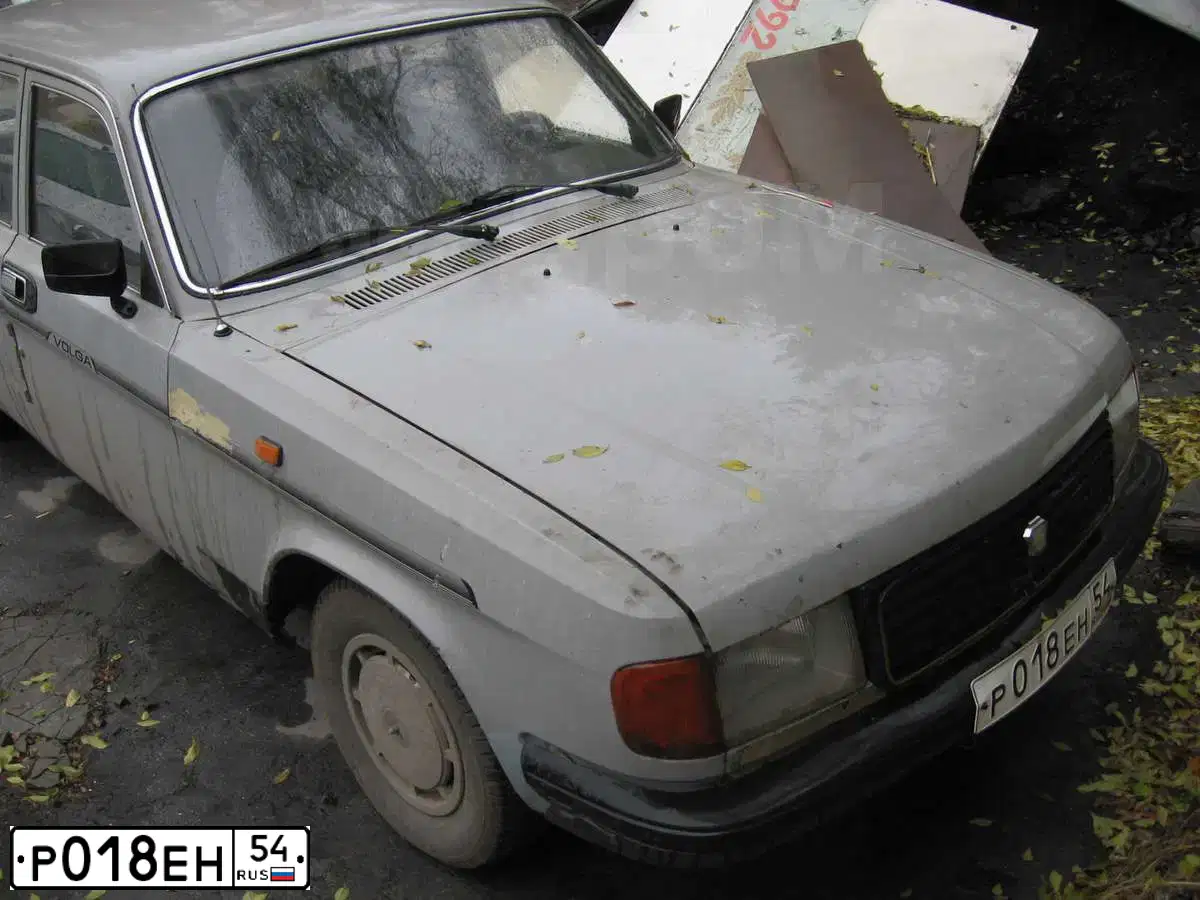 Фото автомобиля GAZ 3102 WOLGA, 1993 — госномер Р018ЕН154. Цвет: СЕРЫЙ