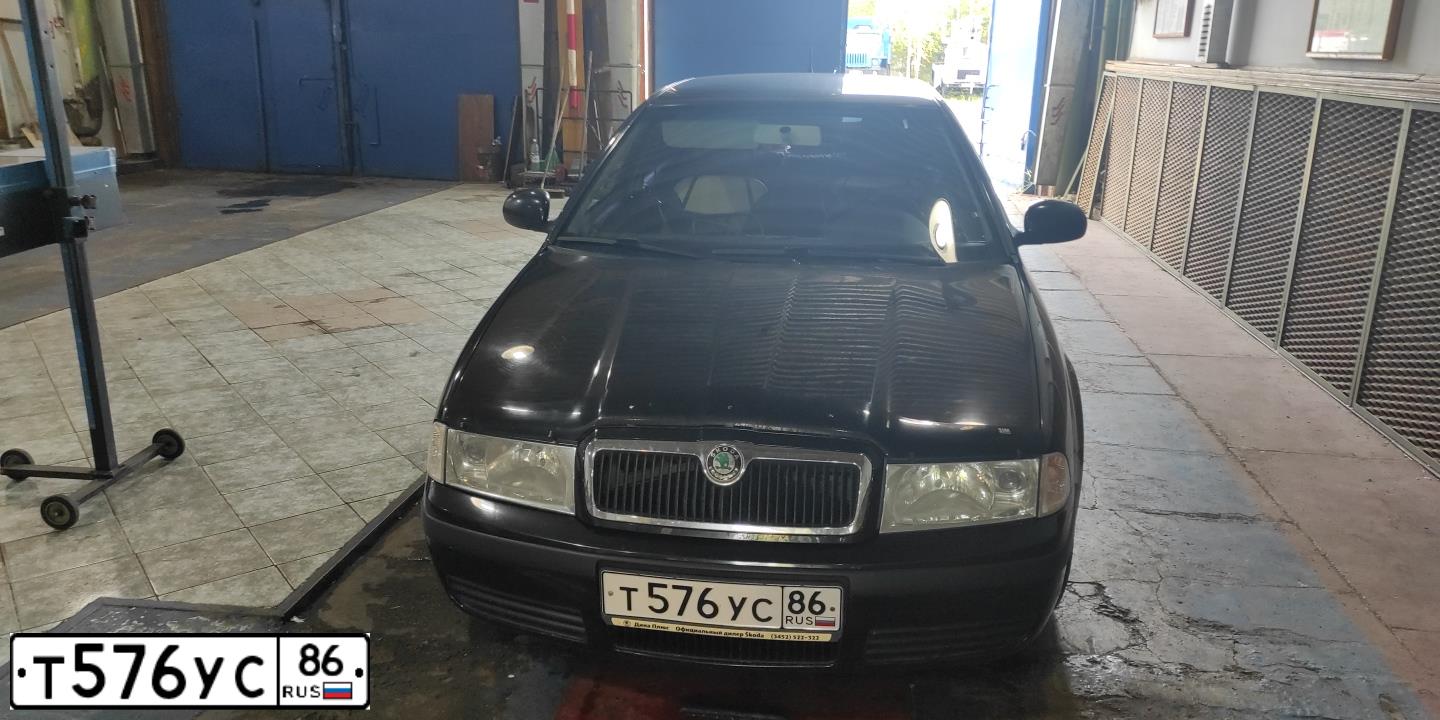 Фото автомобиля SKODA OCTAVIA, 2010 — госномер Т576УС86. Цвет: ЧЕРНЫЙ