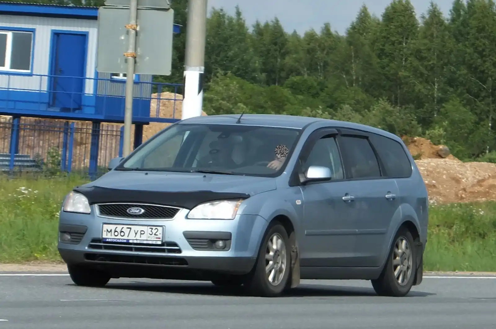 Фото автомобиля FORD FOCUS, 2007 — госномер К122ТМ62. Цвет: СВЕТЛО-СЕРО ГОЛУБОЙ