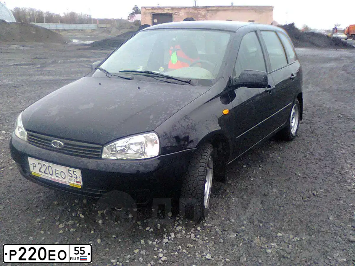 Фото автомобиля LADA 1117 KALINA, 2010 — госномер Р220ЕО55. Цвет: СИНЕ-ЧЕРНЫЙ