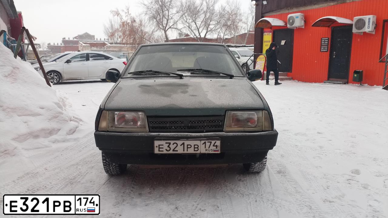 Фото автомобиля LADA 2109 SAMARA, 2003 — госномер Е321РВ174. Цвет: Темно-зеленый