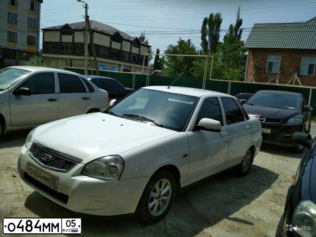 Фото автомобиля LADA PRIORA, 2013 — госномер Т025ОР05. Цвет: Белый