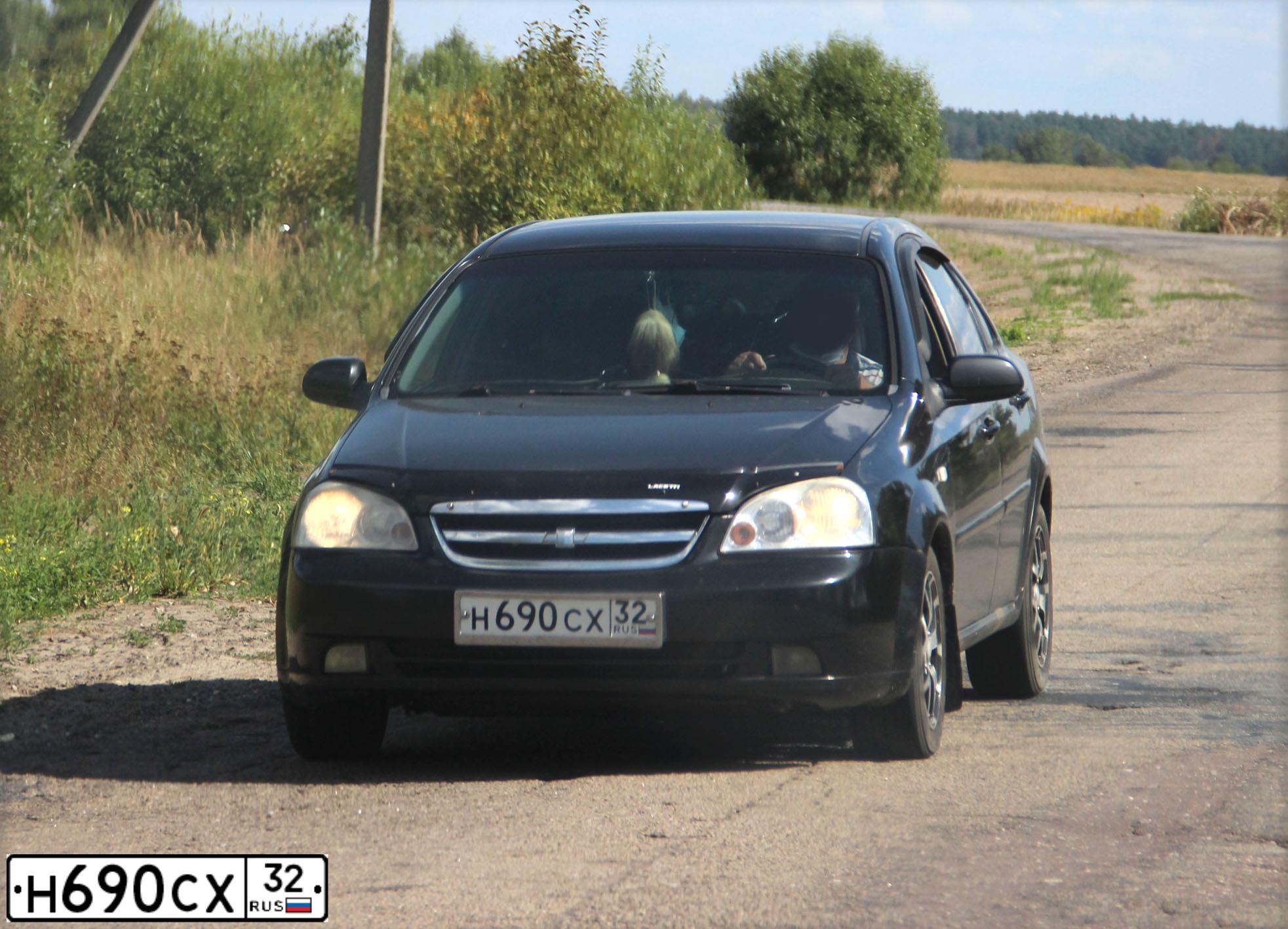 Фото автомобиля CHEVROLET LACETTI, 2008 — госномер Р609ОР32. Цвет: ЧЕРНЫЙ