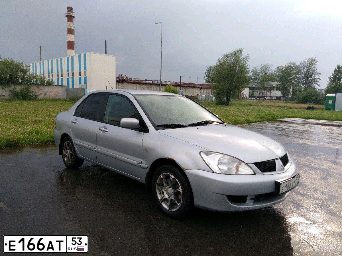 Фото автомобиля MITSUBISHI LANCER, 2007 — госномер К080ЕЕ53. Цвет: СЕРЕБРИСТЫЙ