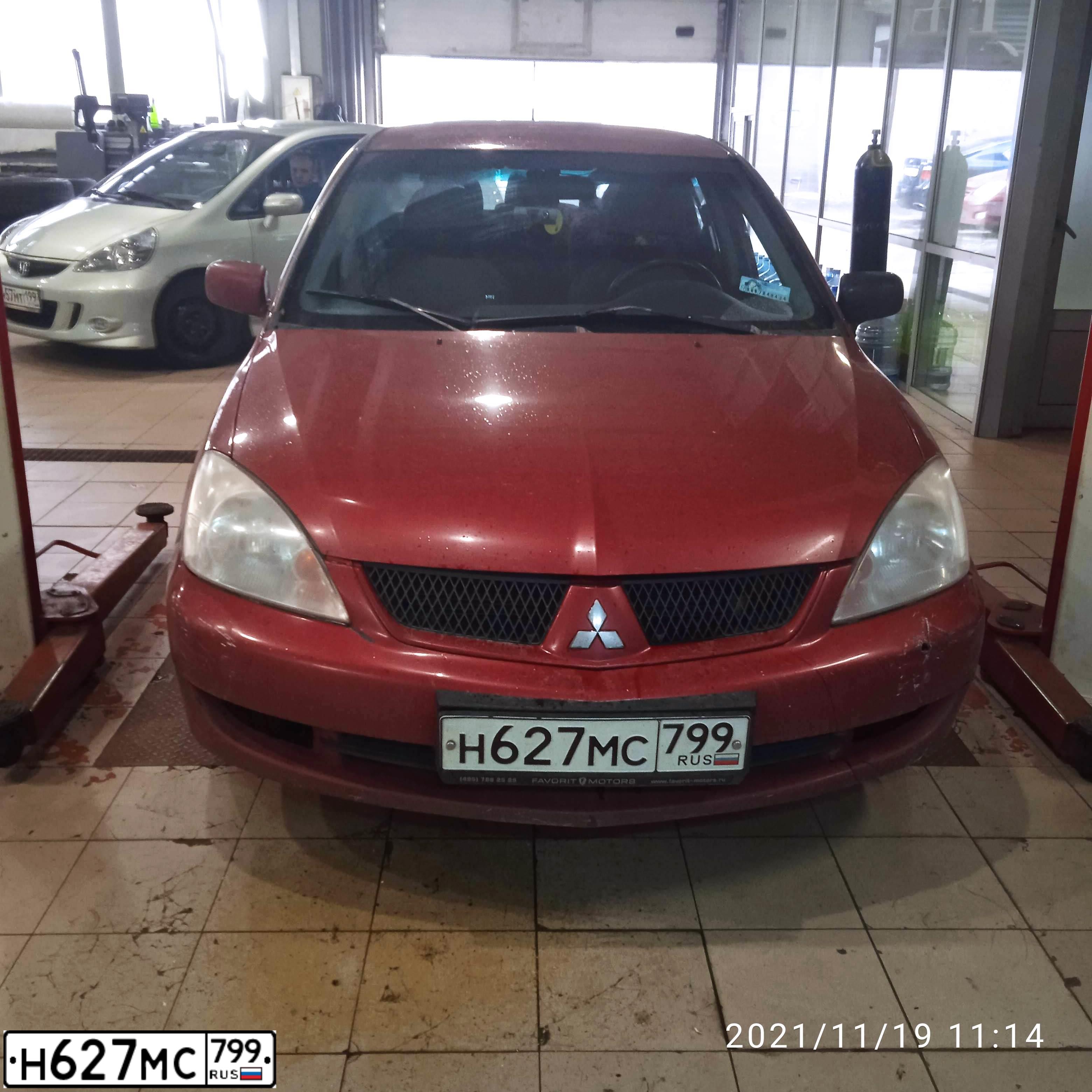 Фото автомобиля MITSUBISHI LANCER, 2006 — госномер Н627МС799. Цвет: Красный