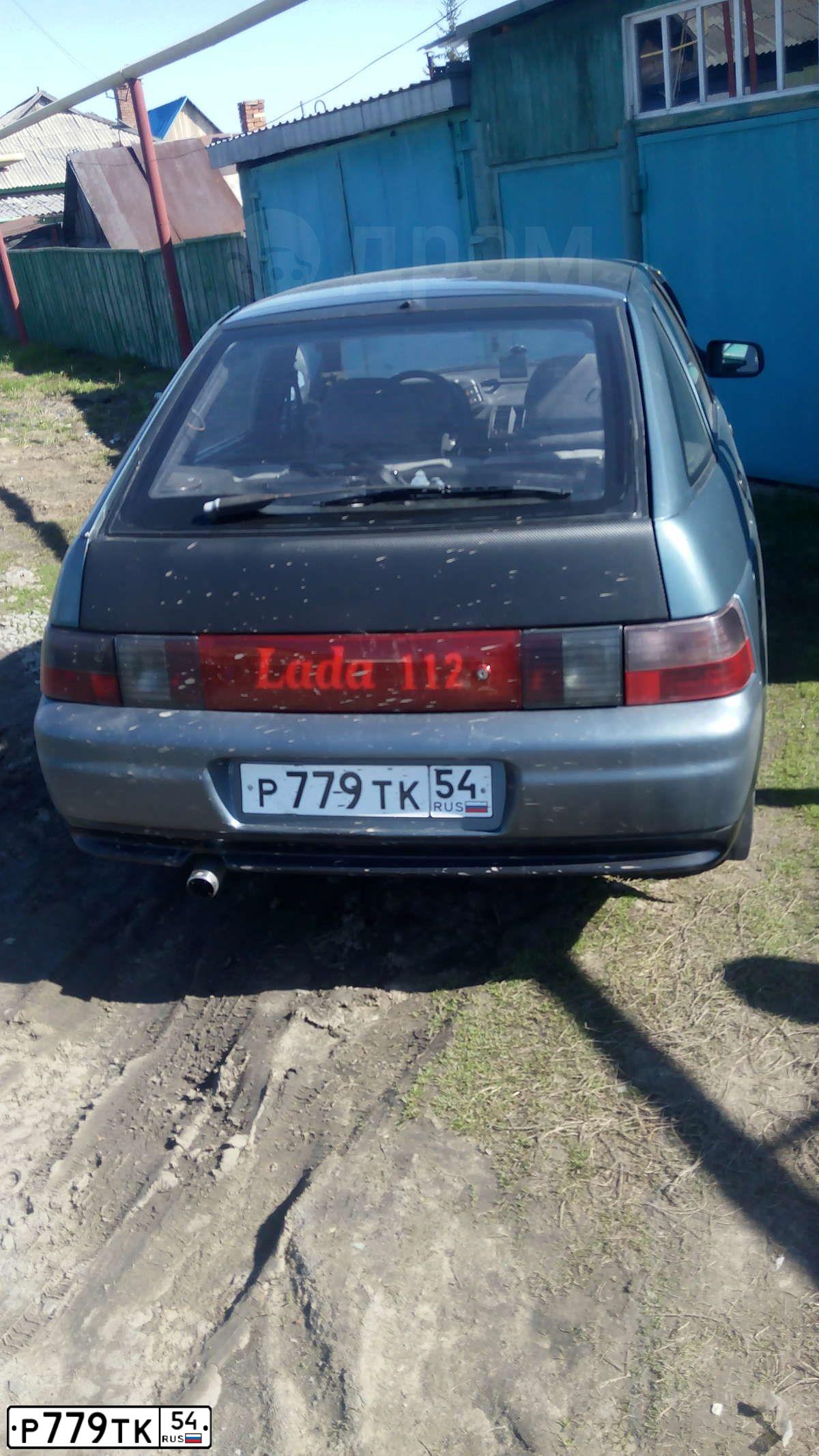 Фото автомобиля LADA 2112, 2000 — госномер Р779ТК54. Цвет: ТЕМНЫЙ СЕРО - СИНИЙ