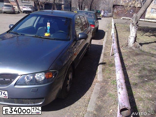 Фото автомобиля NISSAN НИССАНАЛЬМЕРА1.5I, 2004 — госномер Т104ОО02. Цвет: СЕРЫЙ