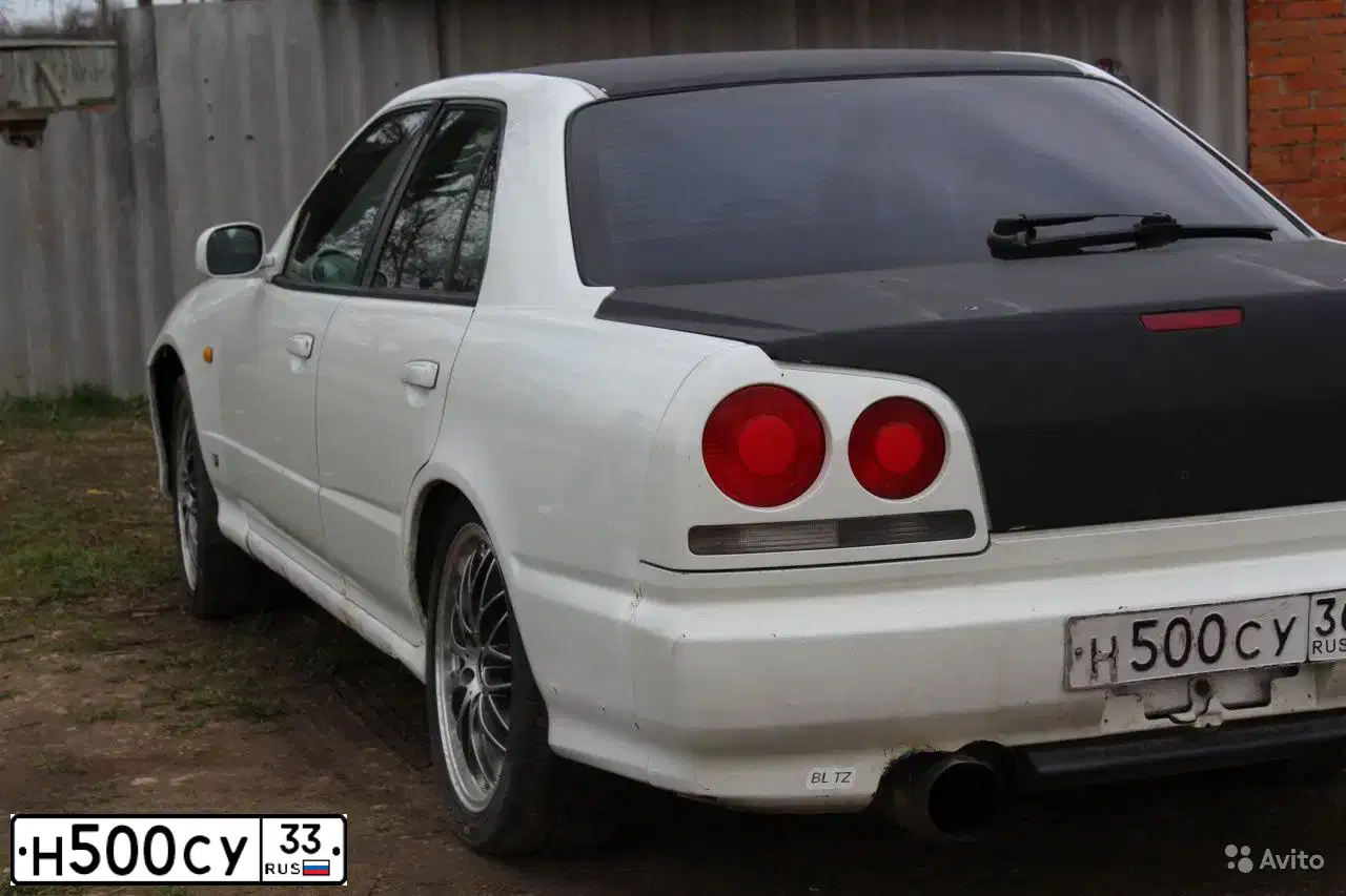 Фото автомобиля NISSAN MAXIMA, 1997 — госномер К182ОЕ33. Цвет: ЗЕЛЕНЫЙ