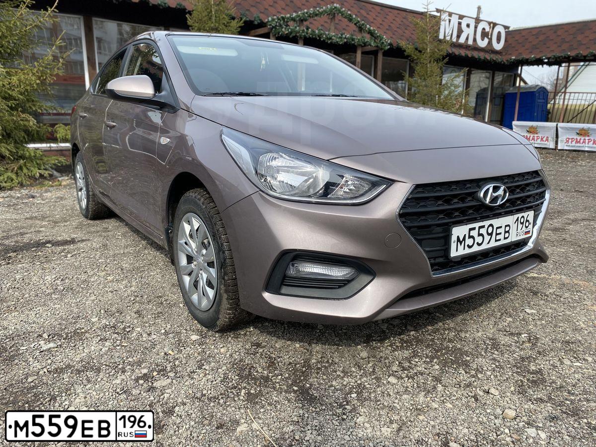 Фото автомобиля HYUNDAI SOLARIS, 2019 — госномер В221УН702. Цвет: СВЕТЛО-КОРИЧНЕВЫЙ