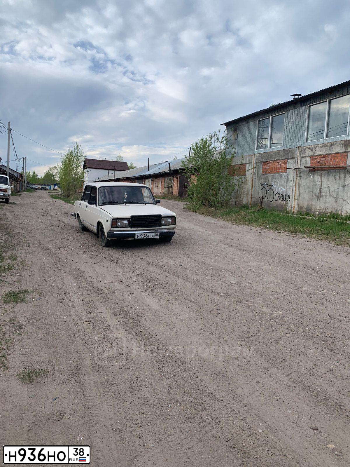 Фото автомобиля LADA 2107, 1994 — госномер Н936НО38. Цвет: БЕЛЫЙ