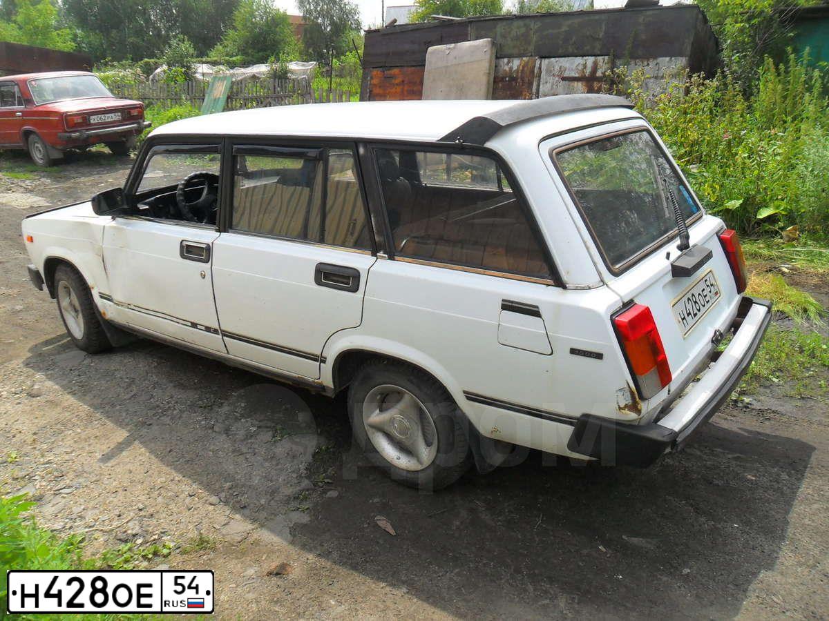 Фото автомобиля LADA 2104, 2001 — госномер Т335ВА54. Цвет: ЯРКО БЕЛЫЙ