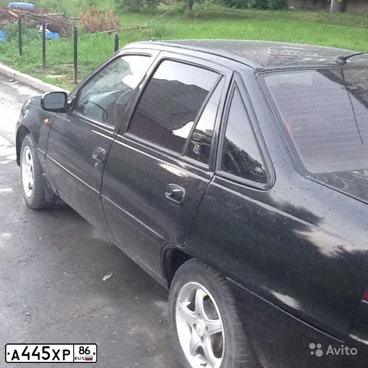 Фото автомобиля DAEWOO NEXIA, 2011 — госномер К889УЕ196. Цвет: ЧЕРНЫЙ