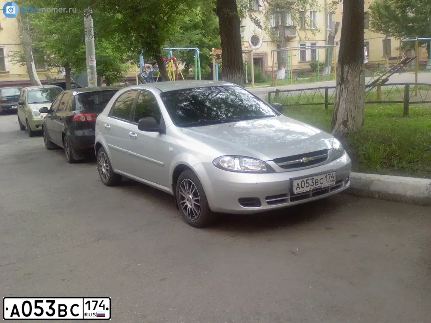 Фото автомобиля CHEVROLET LACETTI, 2010 — госномер А053ВС174. Цвет: СЕРЫЙ