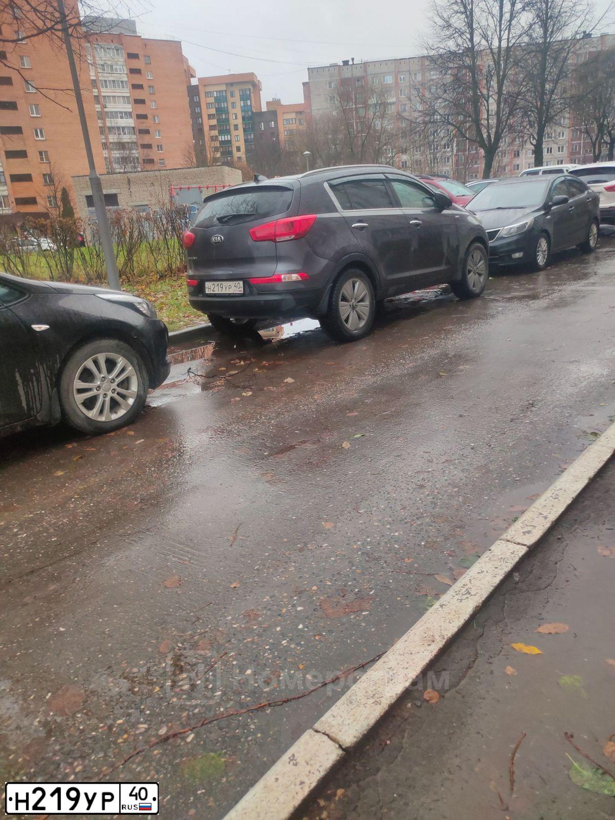 Фото автомобиля KIA SPORTAGE, 2014 — госномер Н219УР40. Цвет: СЕРЫЙ