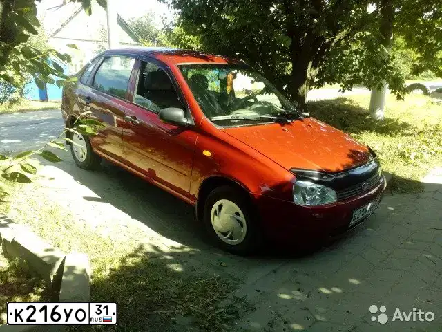Фото автомобиля LADA 1118 KALINA, 2005 — госномер К216УО31. Цвет: СЕРЕБРИСТО-КРАСНЫЙ