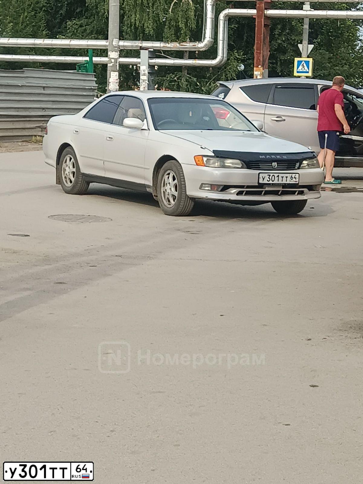 Фото автомобиля MITSUBISHI LANCER, 2005 — госномер Т123ВМ64. Цвет: СВЕТЛО-СЕРО-ЗЕЛЕНЫЙ