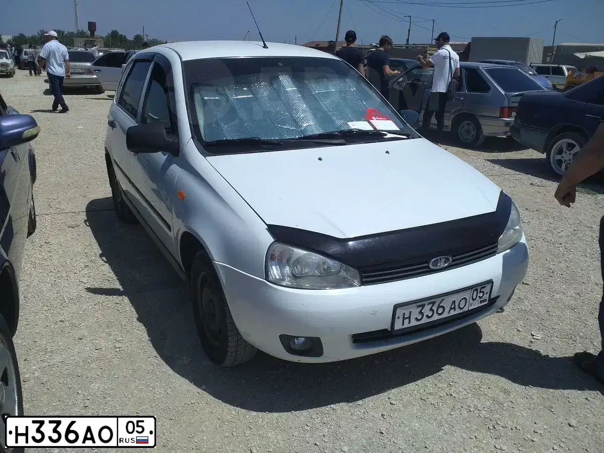 Фото автомобиля LADA 2112, 2005 — госномер К336АО05. Цвет: СЕРЕБРИСТЫЙ