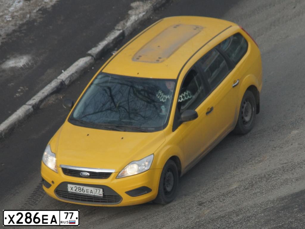Фото автомобиля FORD FOCUS, 2010 — госномер Х286ЕА77. Цвет: ЖЕЛТЫЙ ЧЕРНЫЙ