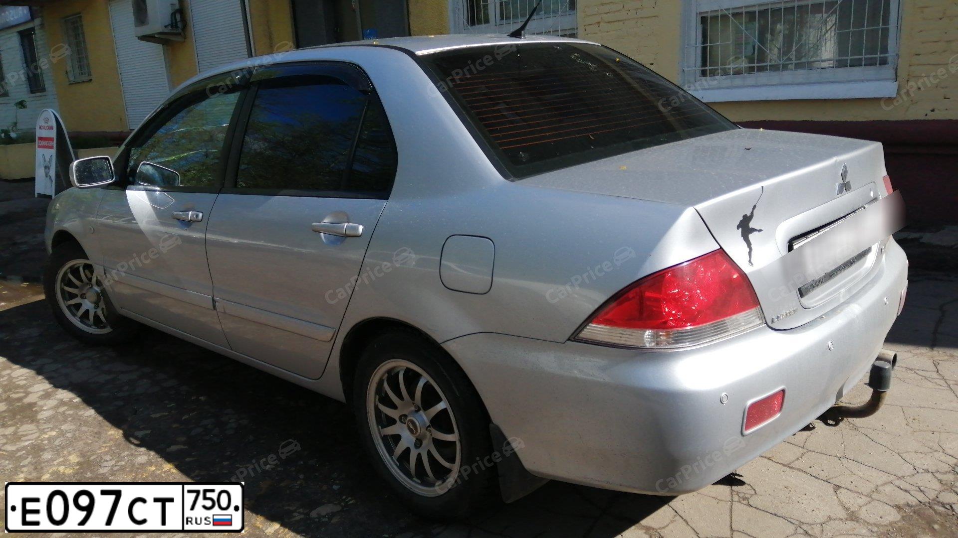 Фото автомобиля MITSUBISHI LANCER, 2005 — госномер О723ХК40. Цвет: Серебристый
