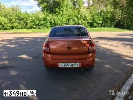 Фото автомобиля LADA 2190 GRANTA, 2014 — госномер Н349НВ46. Цвет: ОРАНЖЕВЫЙ