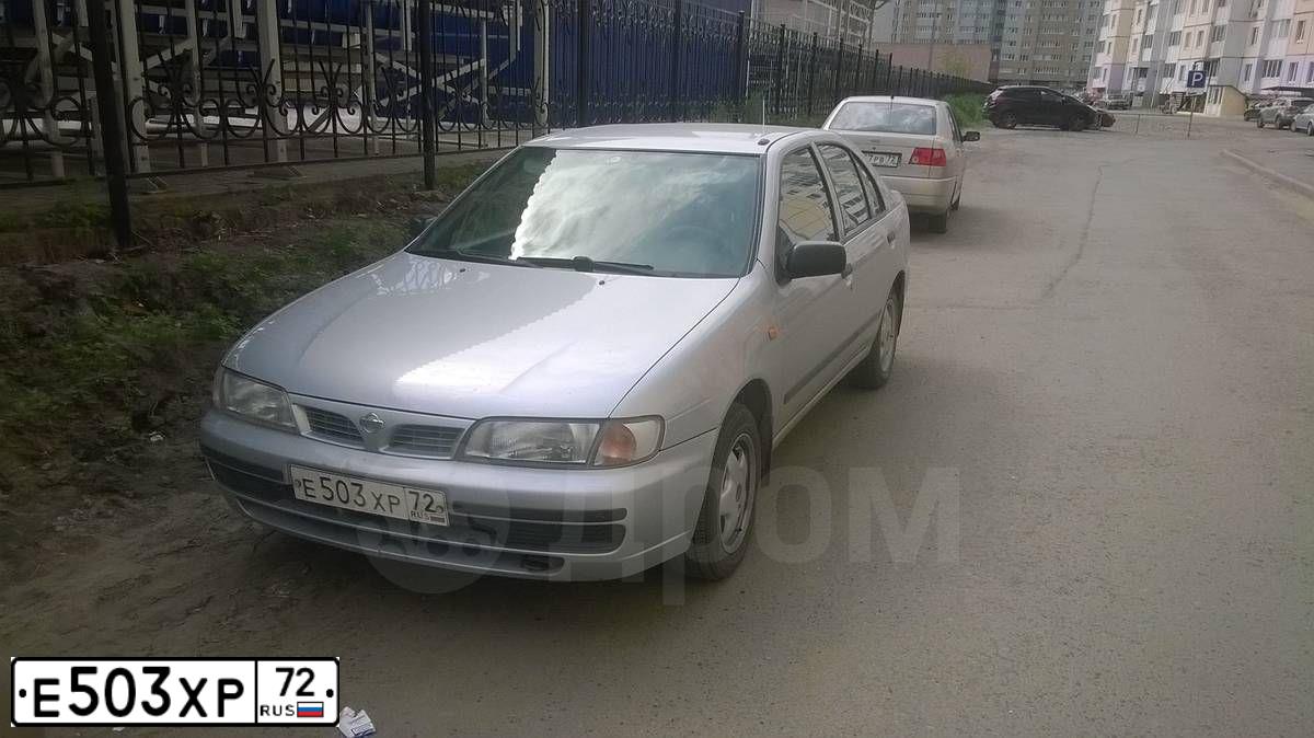 Фото автомобиля NISSAN ALMERA, 1998 — госномер Е503ХР72. Цвет: БЕЛЫЙ (СЕРЕБРИСТЫЙ)