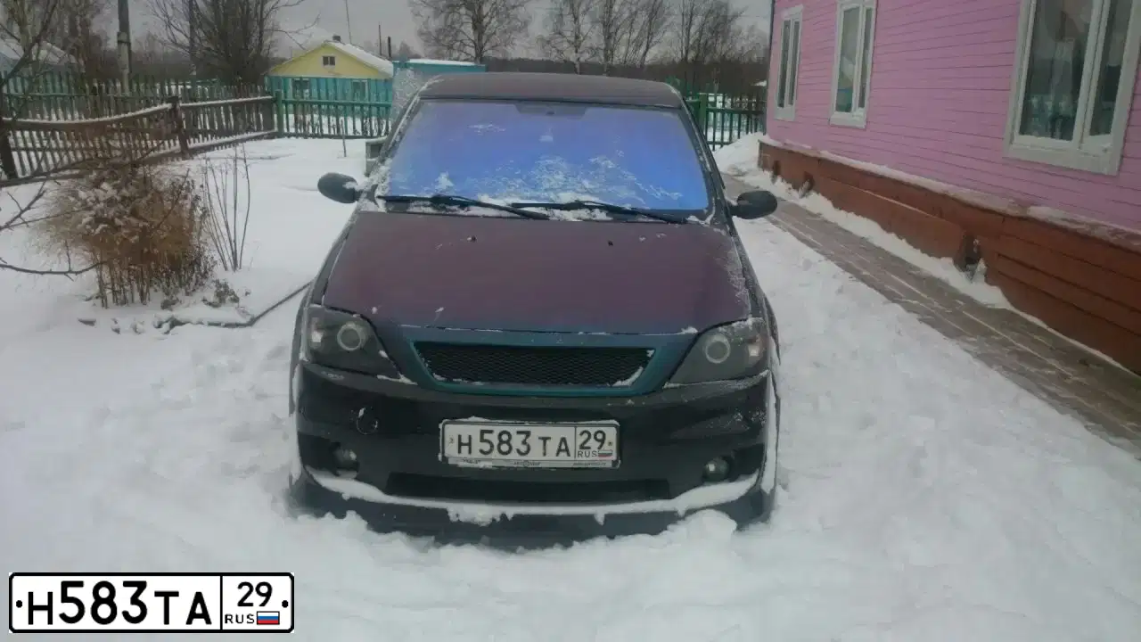Фото автомобиля RENAULT LOGAN, 2009 — госномер О465ОВ29. Цвет: ЧЕРНЫЙ