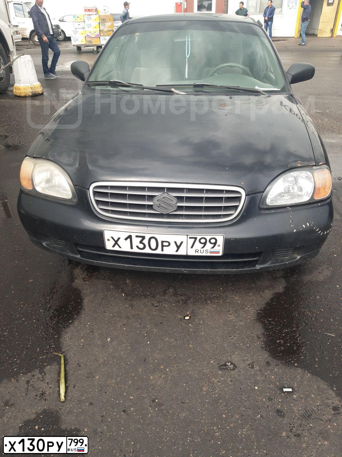 Фото автомобиля SUZUKI BALENO, 2001 — госномер Х130РУ799. Цвет: ЧЕРНЫЙ