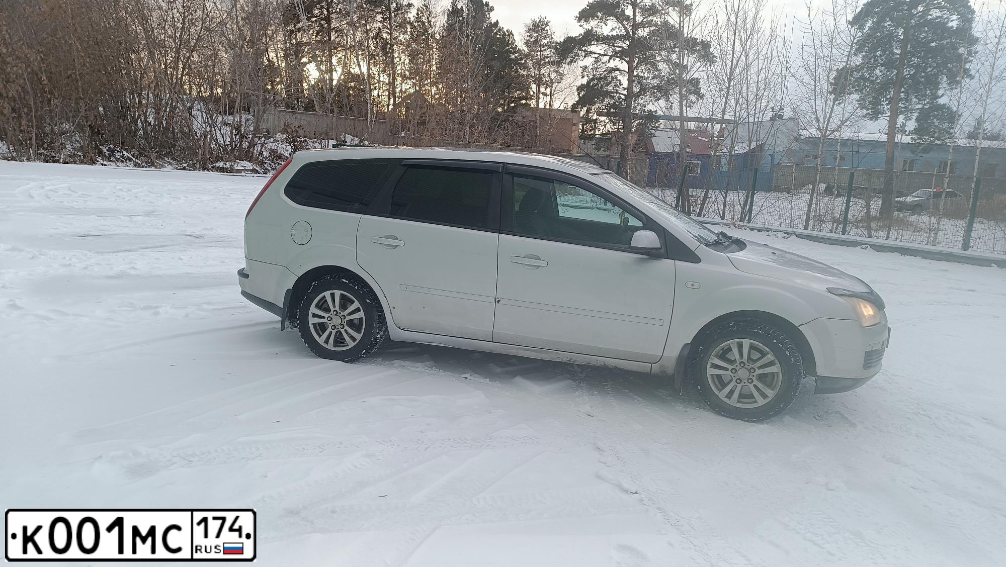 Фото автомобиля FORD FOCUS, 2006 — госномер К001МС174. Цвет: ЧЕРНЫЙ
