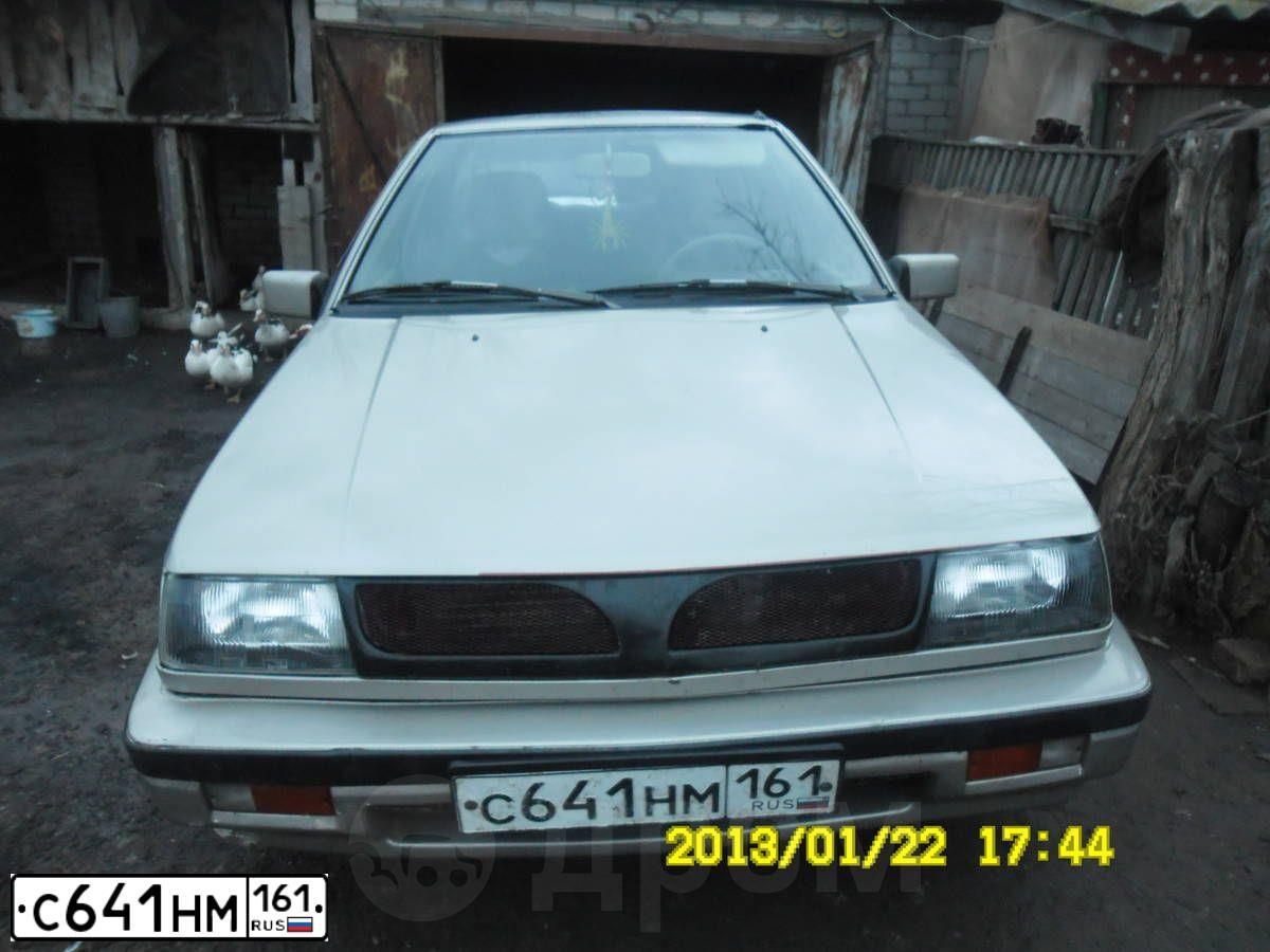 Фото автомобиля MITSUBISHI LANCER, 1987 — госномер С641НМ161. Цвет: С. СЕРЫЙ