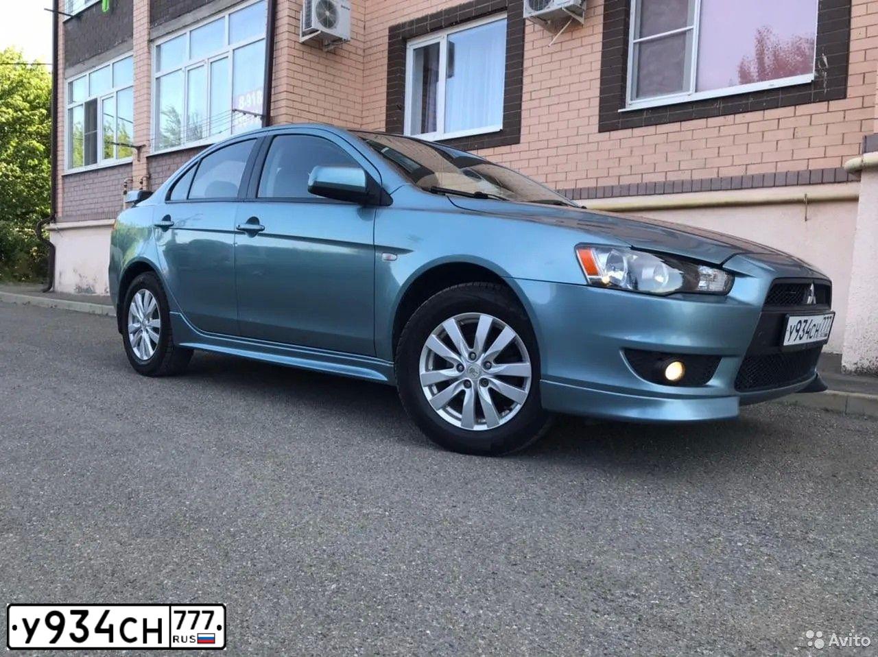 Фото автомобиля MITSUBISHI LANCER, 2007 — госномер В959КВ180. Цвет: СВЕТЛО-СЕРО-ЗЕЛЕНЫЙ