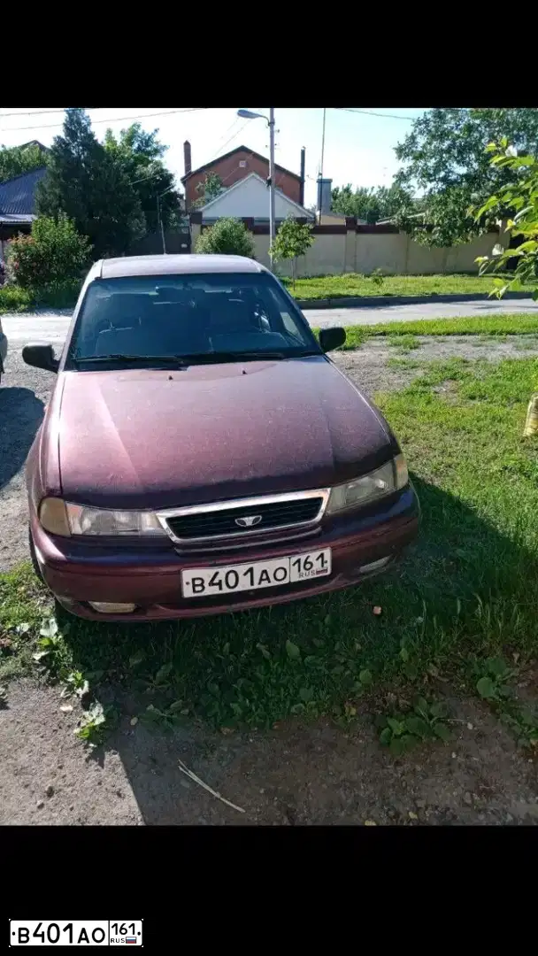 Фото автомобиля DAEWOO NEXIA, 2006 — госномер В401АО161. Цвет: СПЕЛАЯ ВИШНЯ