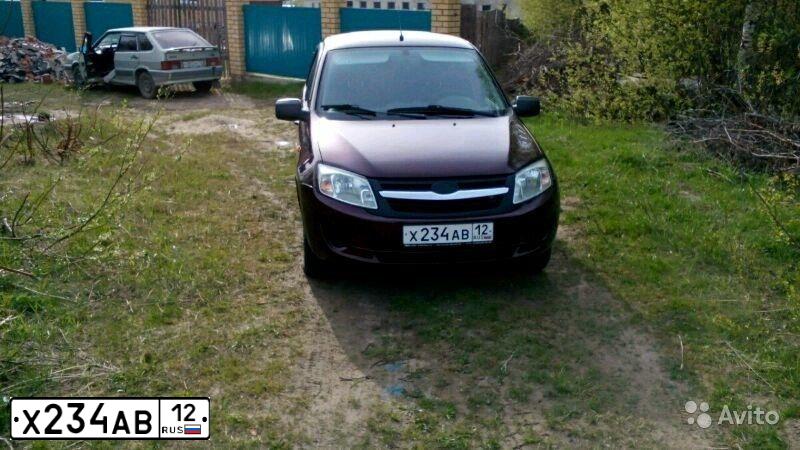 Фото автомобиля LADA GRANTA, 2012 — госномер М221ОР21. Цвет: ТЕМНО-ВИШНЕВЫЙ