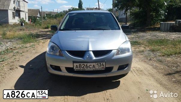 Фото автомобиля MITSUBISHI LANCER, 2003 — госномер Х374ТЕ62. Цвет: Серебристый