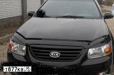 Фото автомобиля KIA CERATO, 2006 — госномер Т877КВ35. Цвет: ЧЕРНЫЙ