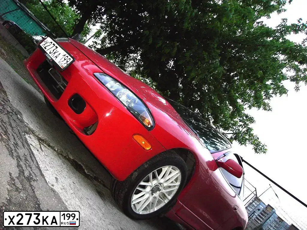 Фото автомобиля LADA 2112, 2003 — госномер Х273КА199. Цвет: СВЕТЛО-СЕРЫЙ