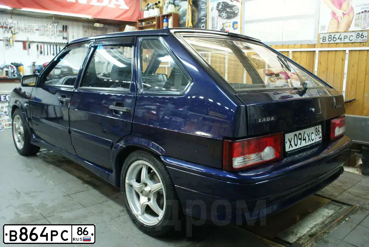 Фото автомобиля LADA 2110, 2001 — госномер Е380КЕ186. Цвет: Темно-зеленый
