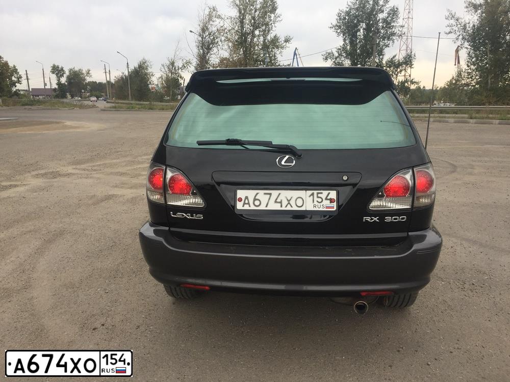 Фото автомобиля LEXUS RX, 2001 — госномер М023МА138. Цвет: ЧЕРНЫЙ
