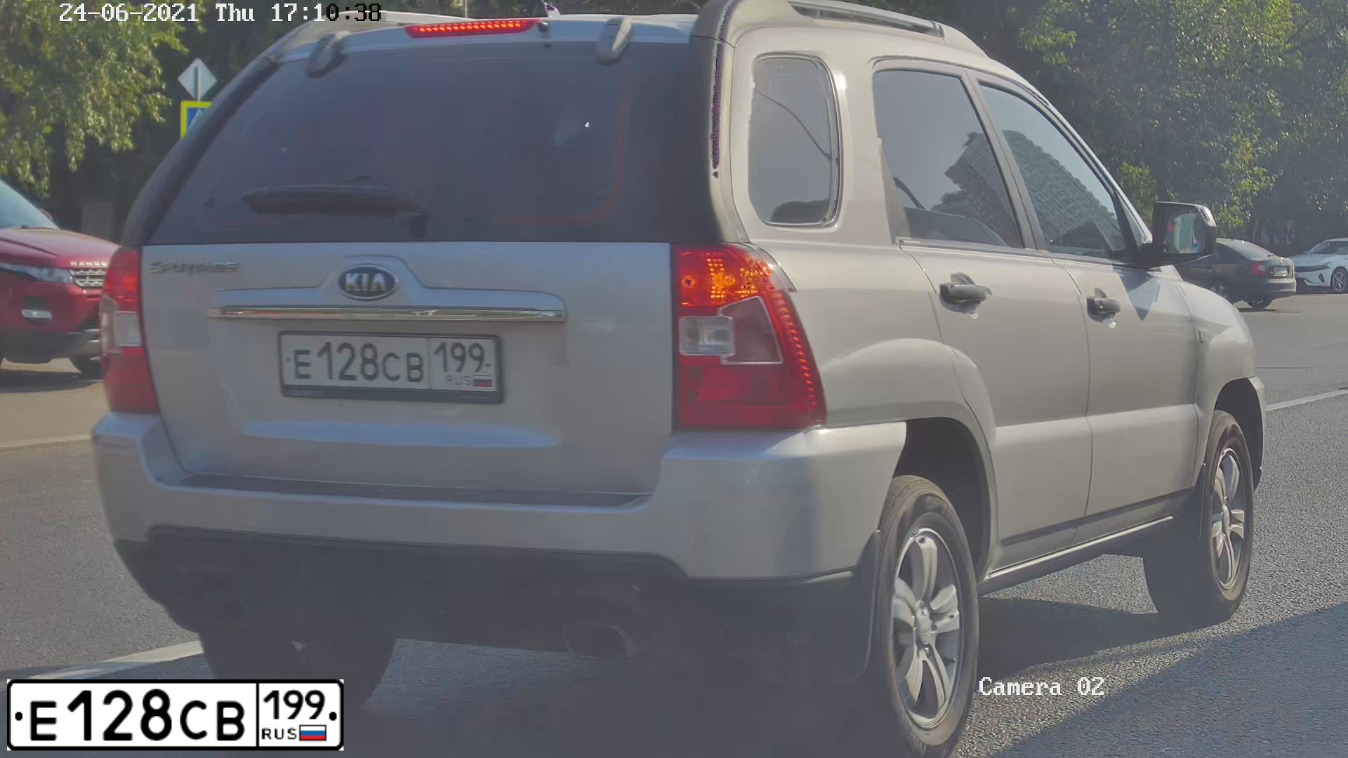 Фото автомобиля KIA SPORTAGE, 2009 — госномер Е128СВ199. Цвет: СЕРЫЙ СВЕТЛЫЙ