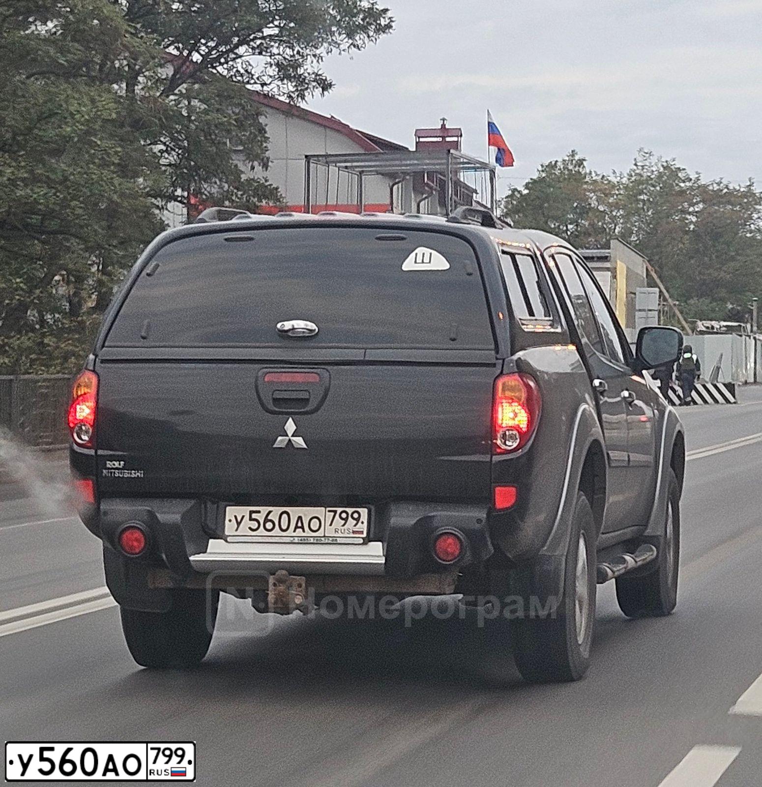 Фото автомобиля MITSUBISHI L200, 2012 — госномер Х400ТТ31. Цвет: ЧЕРНЫЙ