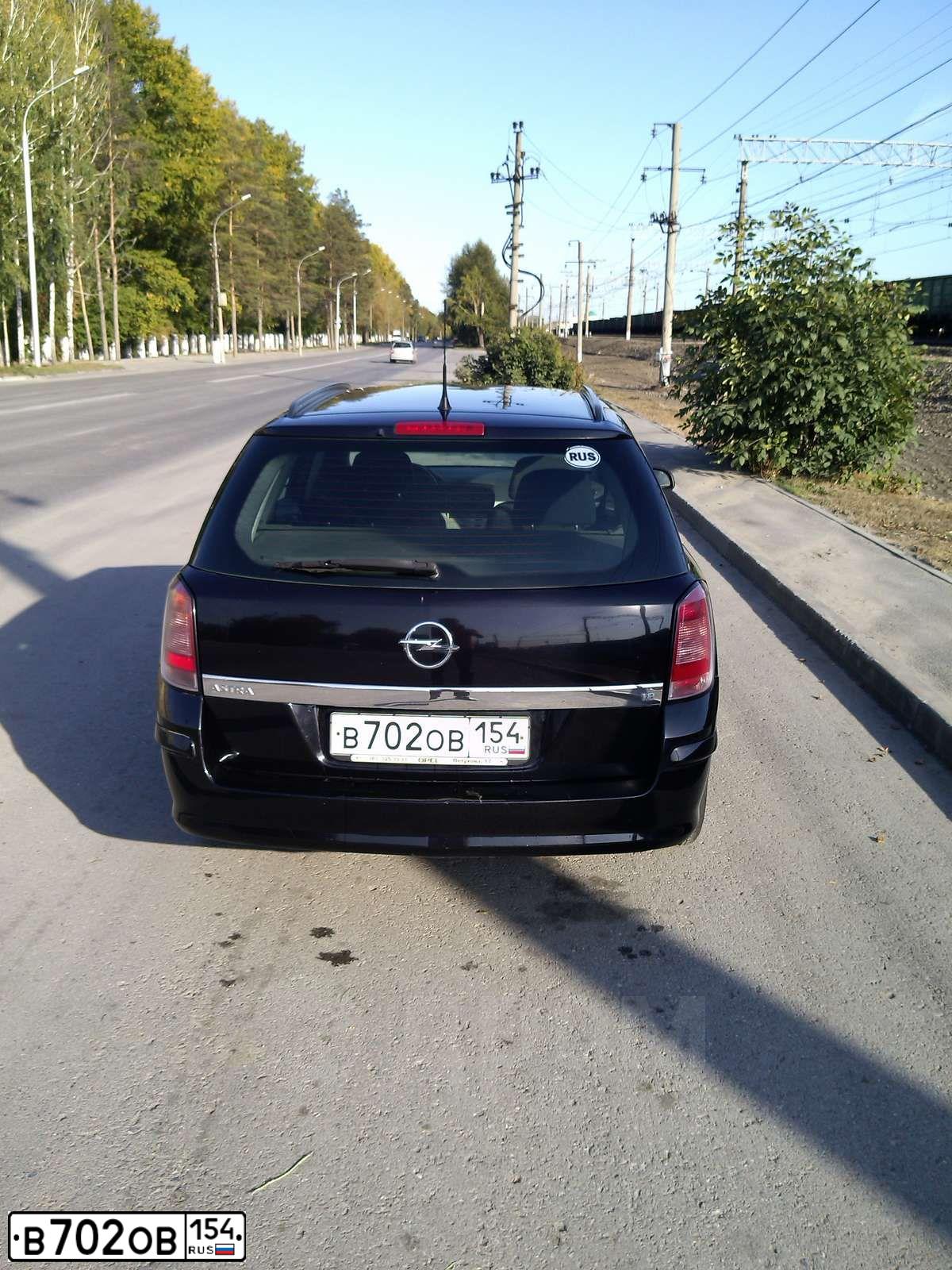 Фото автомобиля OPEL ASTRA, 2007 — госномер В702ОВ154. Цвет: ЧЕРНЫЙ