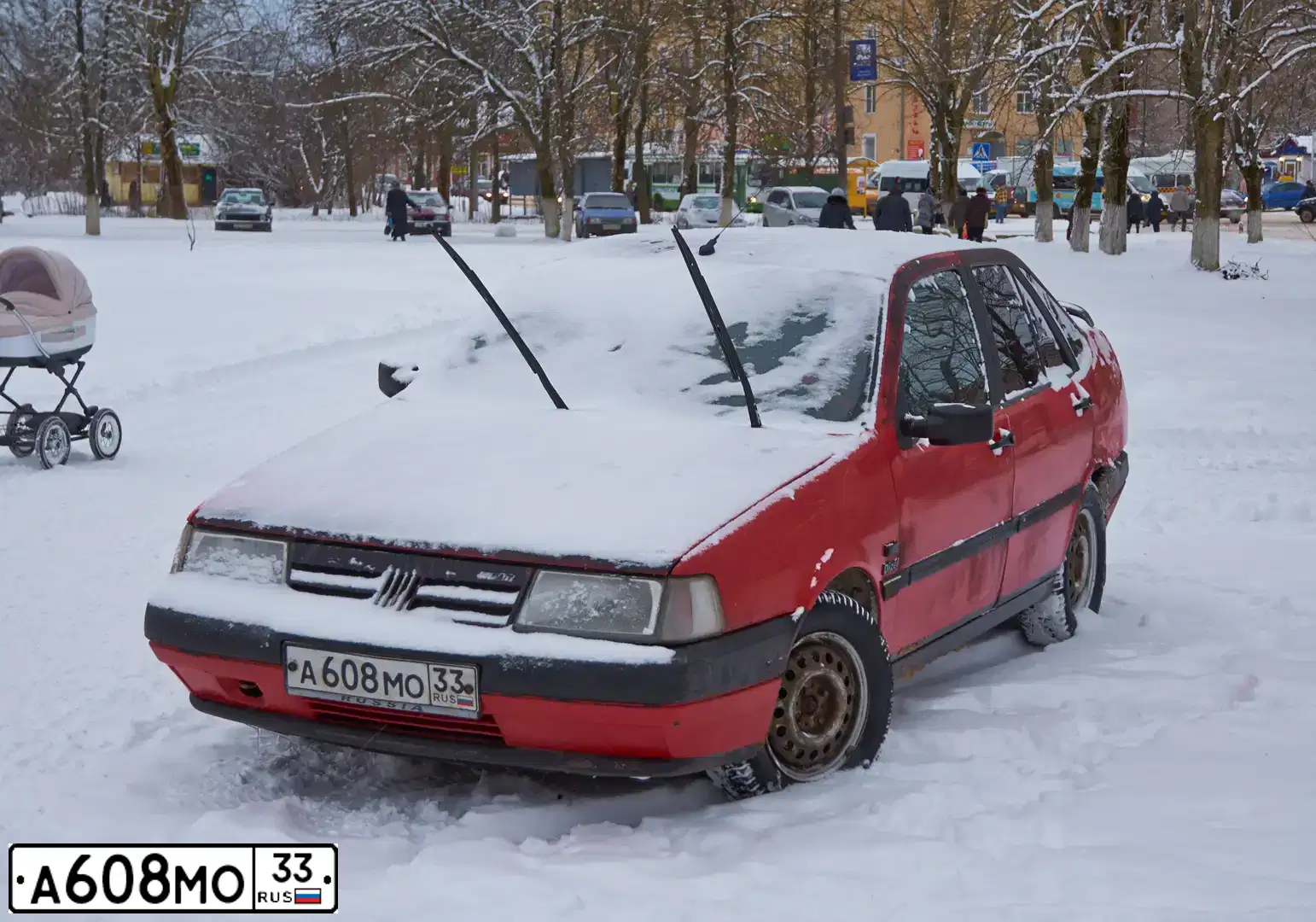 Фото автомобиля FIAT TEMPRA, 1991 — госномер Е105ОХ26. Цвет: КРАСНЫЙ