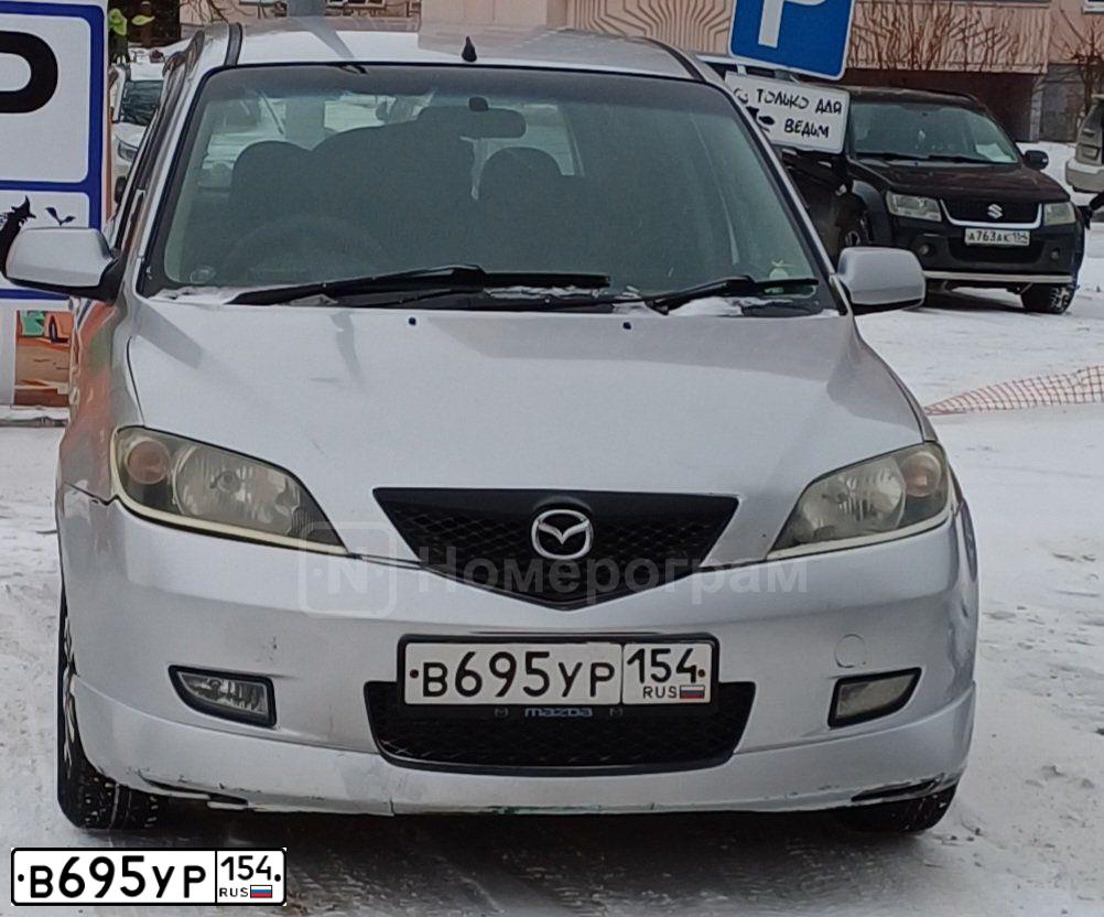 Фото автомобиля MITSUBISHI MONTERO, 2003 — госномер В695УР154. Цвет: ЧЕРНЫЙ