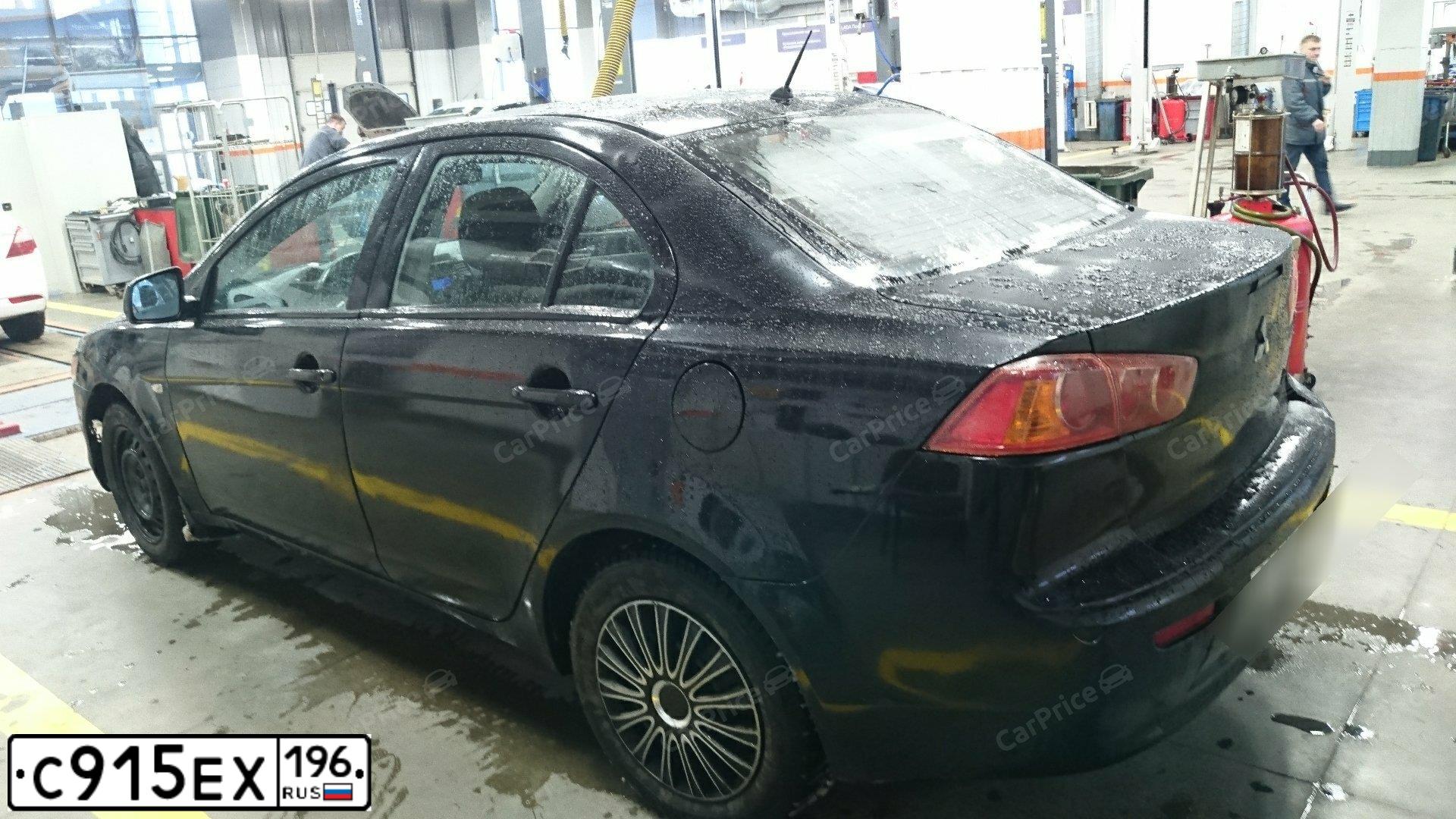 Фото автомобиля MITSUBISHI LANCER, 2007 — госномер У692АК774. Цвет: ЧЕРНЫЙ