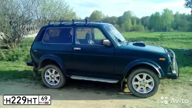 Фото автомобиля LADA NIVA, 2000 — госномер К066КЕ53. Цвет: сине-зеленый