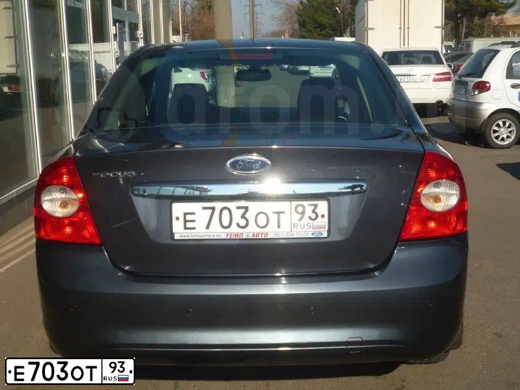 Фото автомобиля FORD FOCUS, 2008 — госномер Е703ОТ93. Цвет: темно-серый