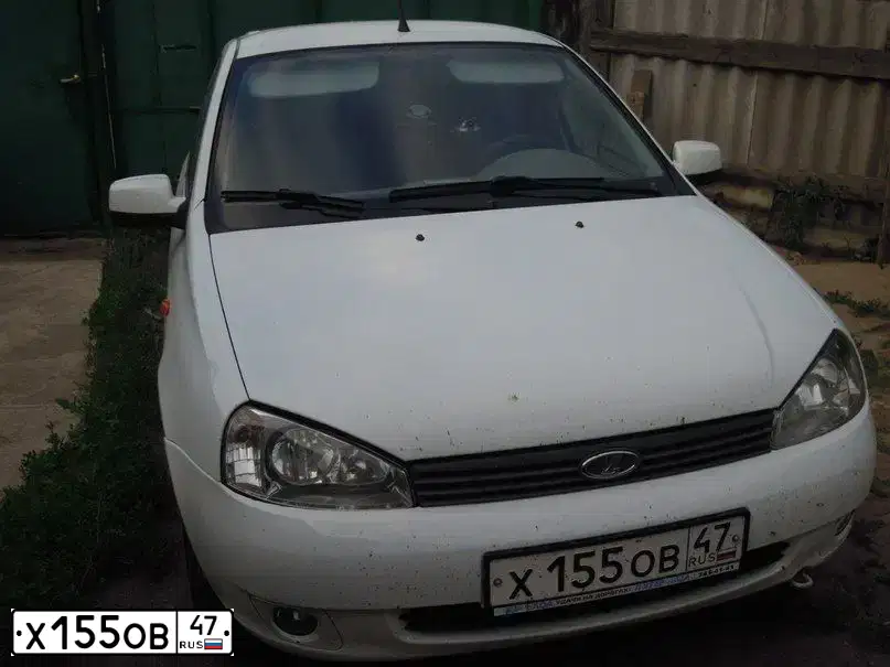 Фото автомобиля LADA 1117 KALINA, 2009 — госномер К351ВТ53. Цвет: Белый