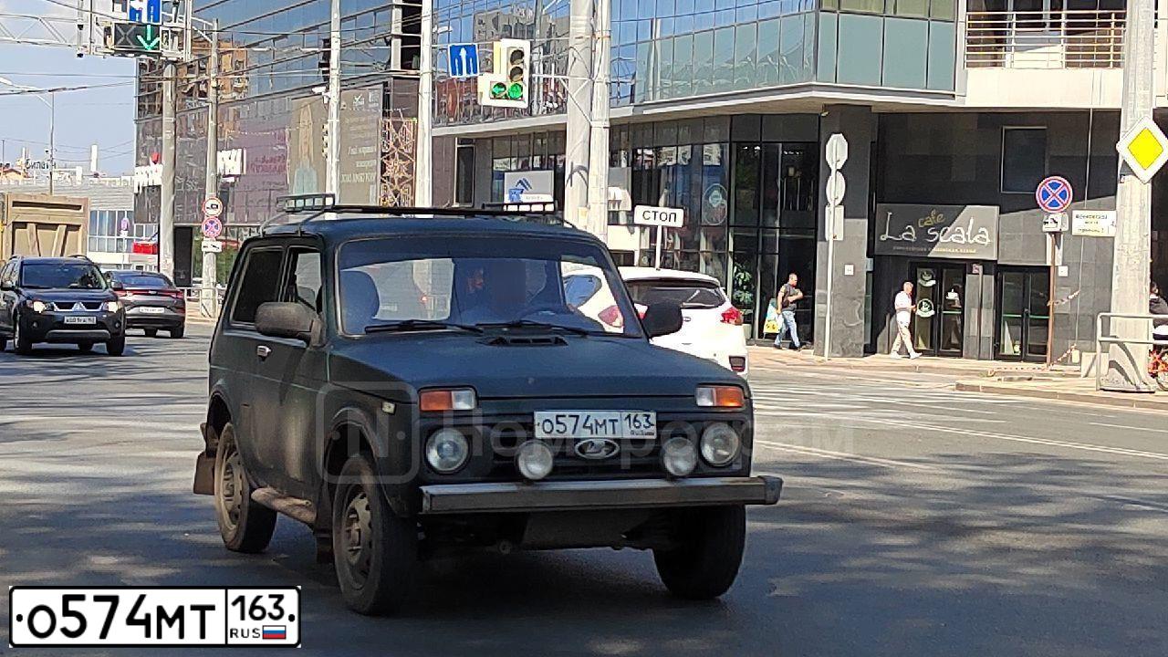 Фото автомобиля LADA 2121 NIVA, 2011 — госномер О574МТ163. Цвет: Темно-зеленый