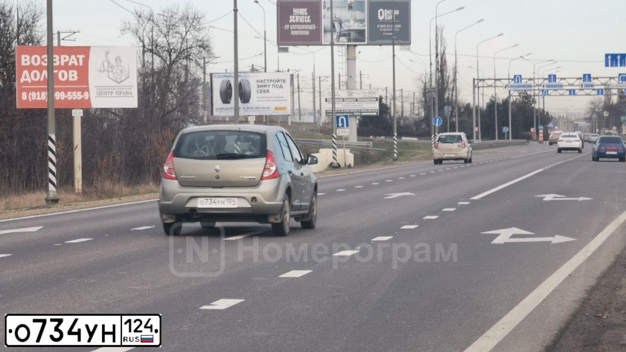 Фото автомобиля RENAULT SANDERO, 2011 — госномер О734УН124. Цвет: БЕЖЕВЫЙ