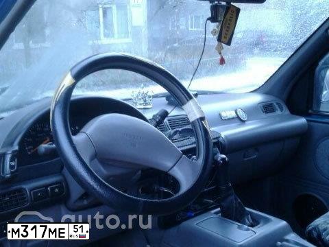 Фото автомобиля NISSAN SERENA, 1995 — госномер К014КУ51. Цвет: Сине-зеленый